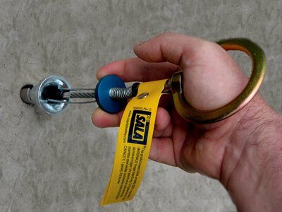 Concrete Wedge Anchor - Installs into 3/4 in. (19mm) hole - Easy grip trigger - Quick release plug - Shielded release cables - 360-degree swiveling D-ring - 3M DBI-SALA 2100085 image 1