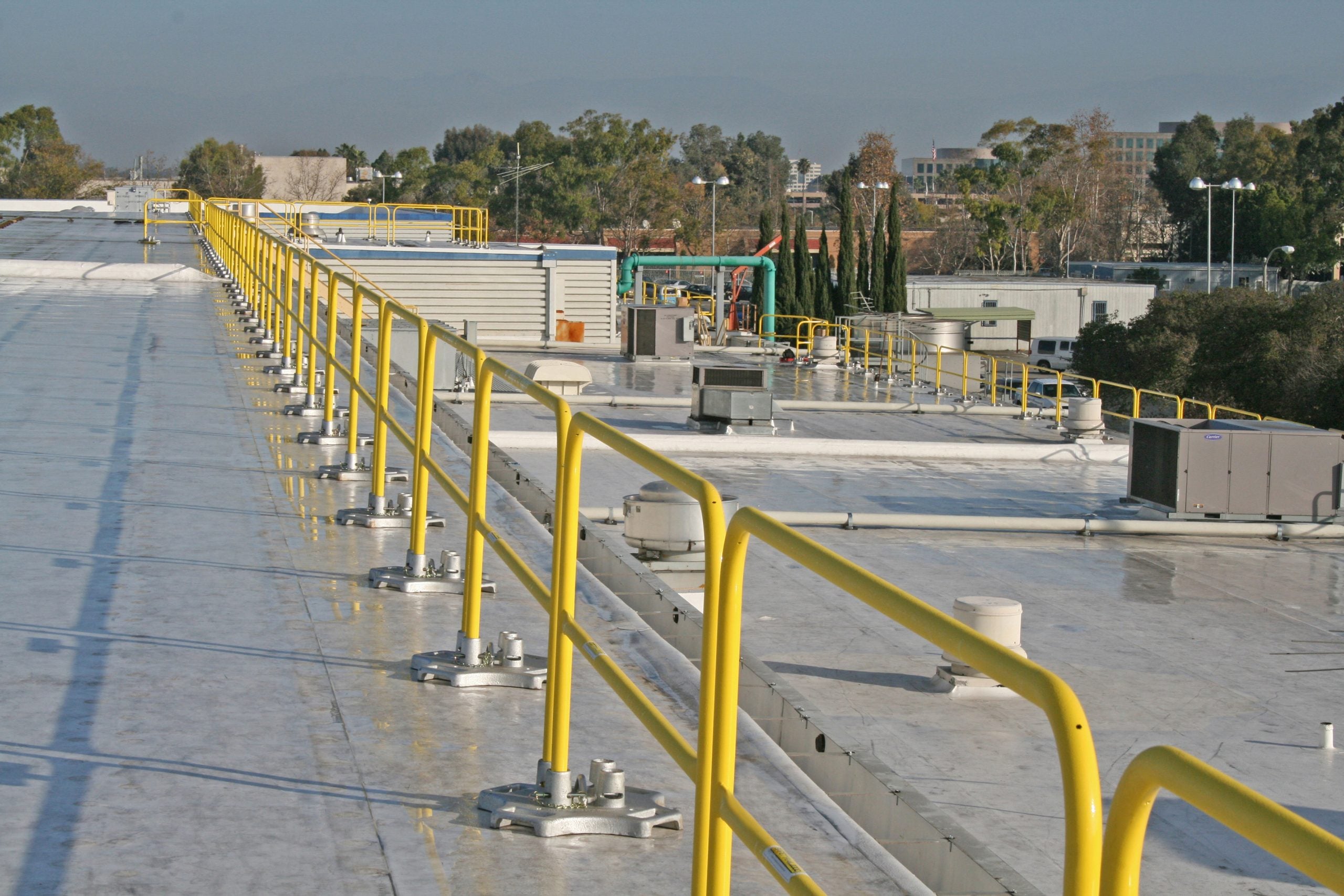 Safety Rail 2000 (SR2K) rooftop guardrail system - Non-penetrating fall protection safety rail - Portable or permanent installation - OSHA compliant - BlueWater SR2000
